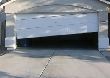 garage door off track repair in in Huntington Park